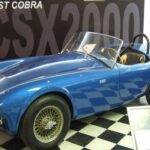 Durante su estancia en Europa, Shelby comprendió el potencial de los deportivos británicos ligeros y buscó combinarlos con la potencia americana. Su elección fue el AC Ace, al que le instaló un motor Ford V8, primero de 260 ci y luego de 289 ci. Este vehículo, llamado CSX2000, se convirtió en el punto de partida de la leyenda Shelby Cobra.